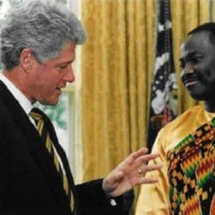 Dr Spio with Clinton