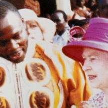 Dr Spio with queen of England small